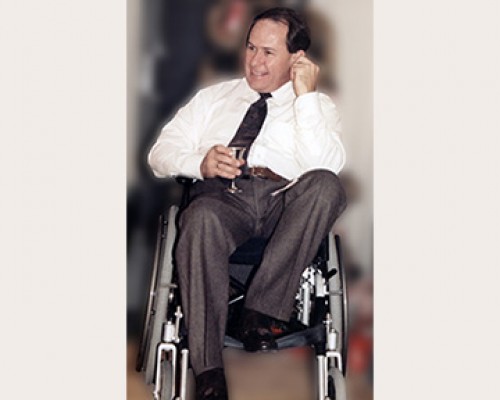 Kirby Rowe, First Executive Director of the Ontario Division Kirby Rowe, smiling, seated with a drink in his hand