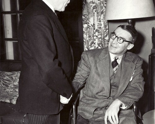 Prime Minister Louis St. Laurent shaking John Counsell's hand.