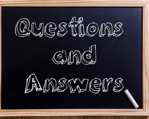Questions and Answers A chalk board with Questions and Answers written on it.