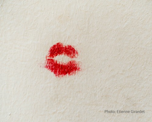 A lipstick kiss on paper.