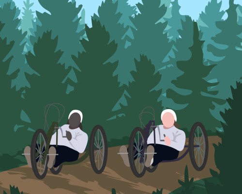 Two people out for a handcycle trip in the forest. Two people out for a handcycle trip in the forest.