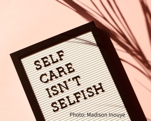A letter board with self care isn't selfish written on it.