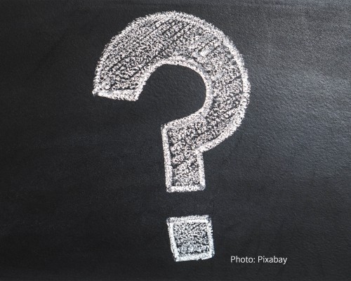 A question mark drawn with chalk. A question mark drawn with chalk.