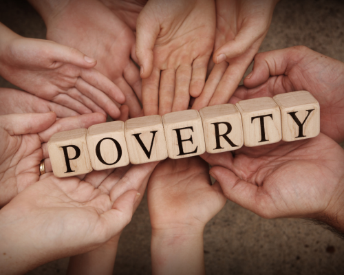 many people's hands together holding the word poverty