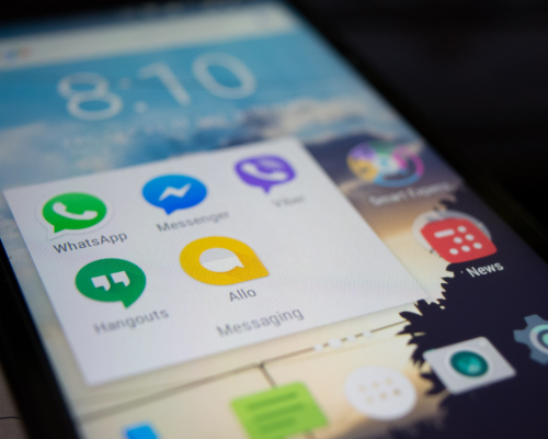 Smart Phone Communications close up of a smart phone with communication apps highlighted like whatsapp and messenger