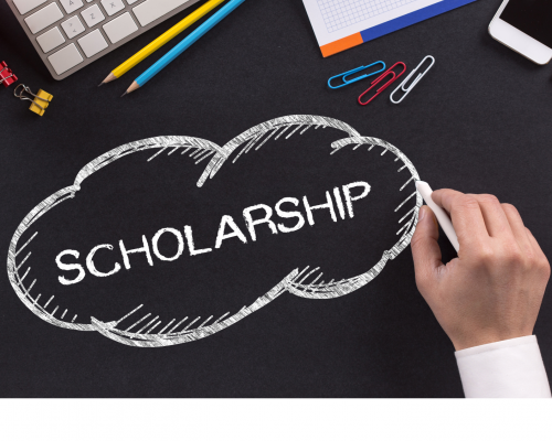 the word "scholarship" written on a desk in chalk