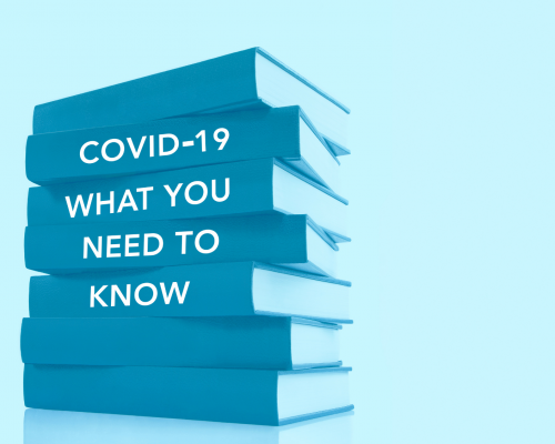 Books stacked on their sides with the words 'Covid-19 What You Need To Know' written on the spines